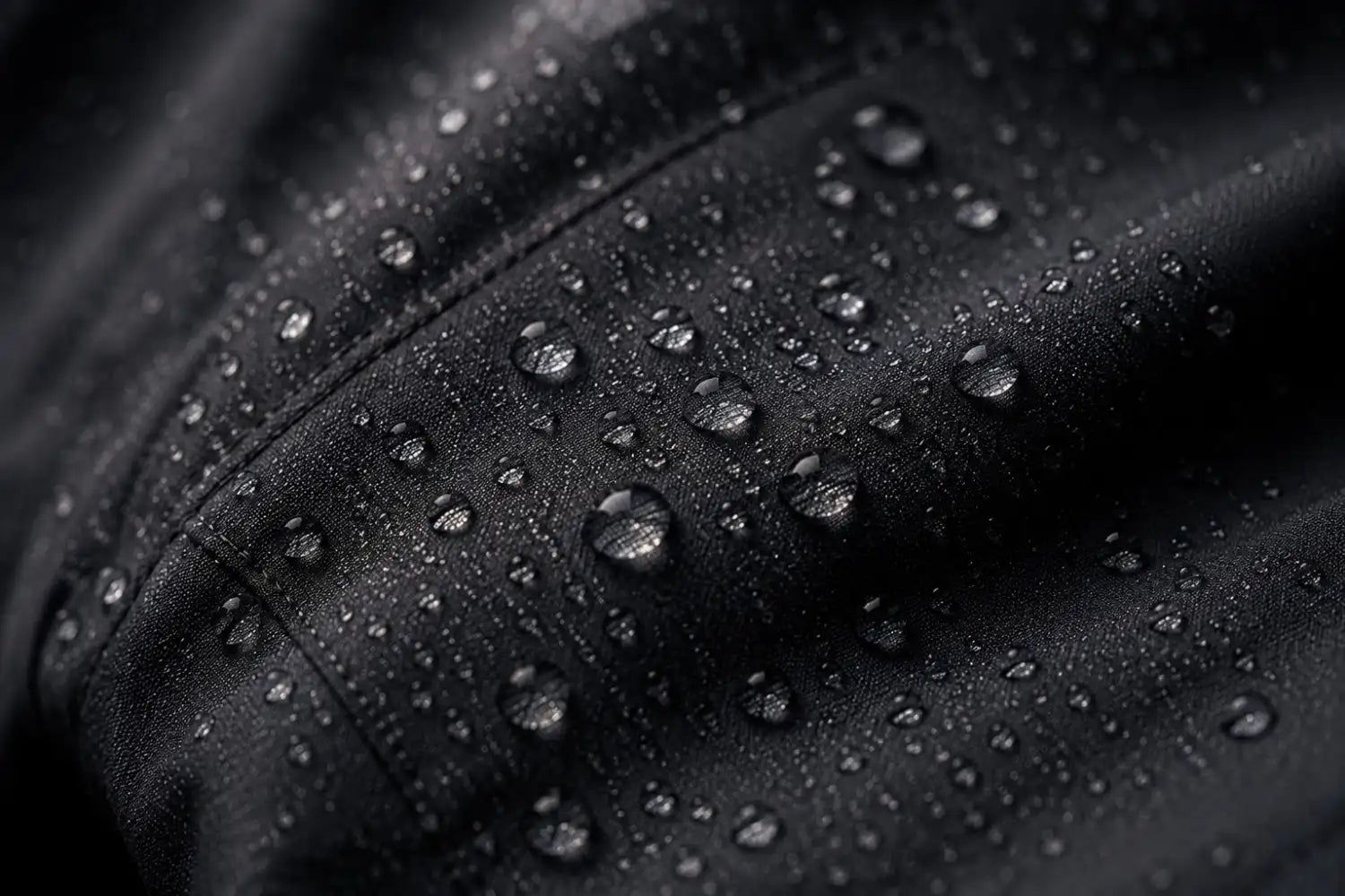 Close-up of water droplets on a black surface