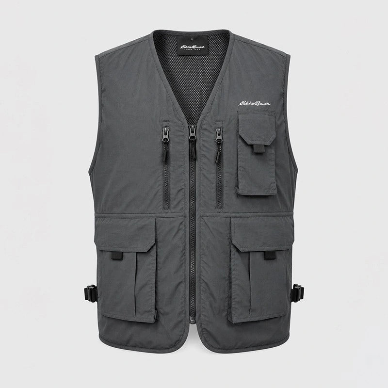 A dark gray zip-up vest with multiple utility pockets, shown against a light gray background. The brand 'Eddie Biers' is visible on the chest and inner label.