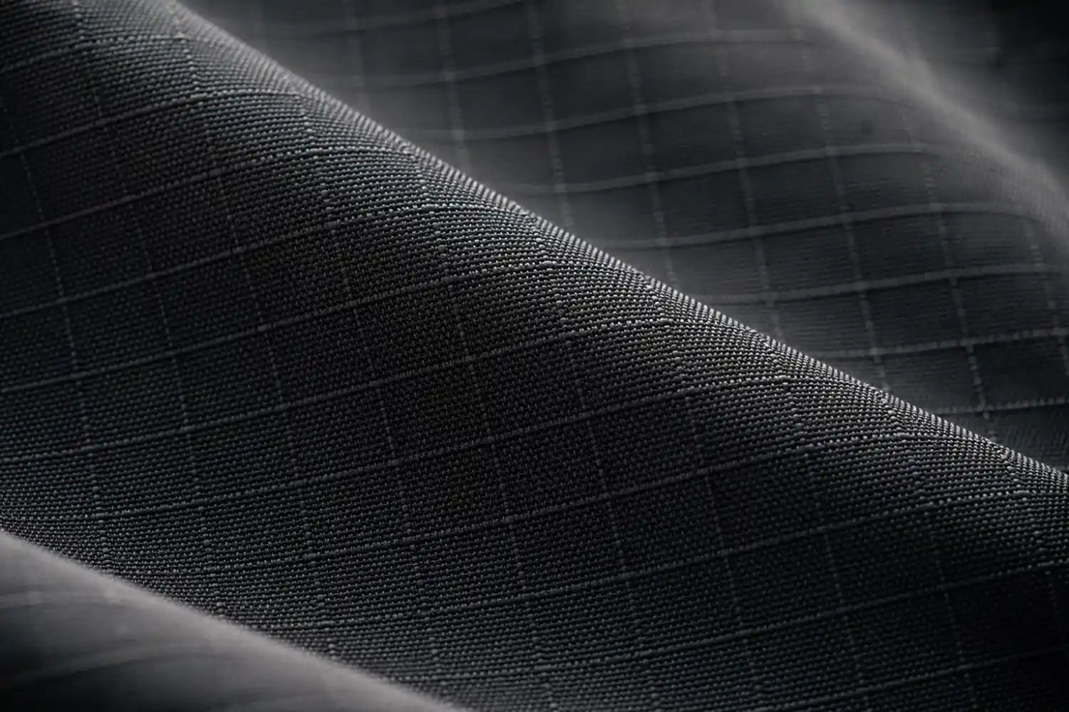 Close-up of a textured black fabric surface
